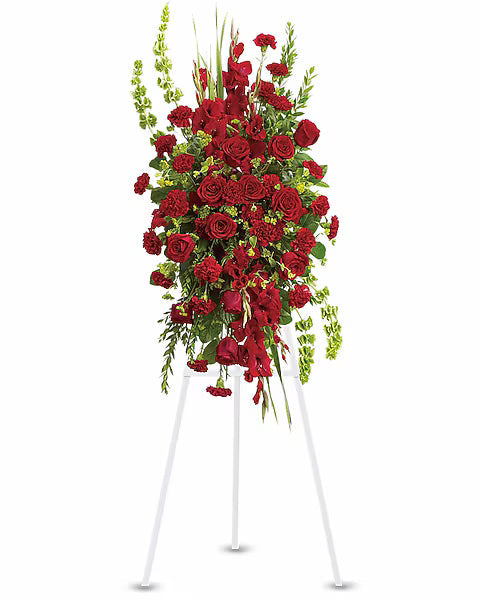 Elegant red rose bouquet displayed on white stand