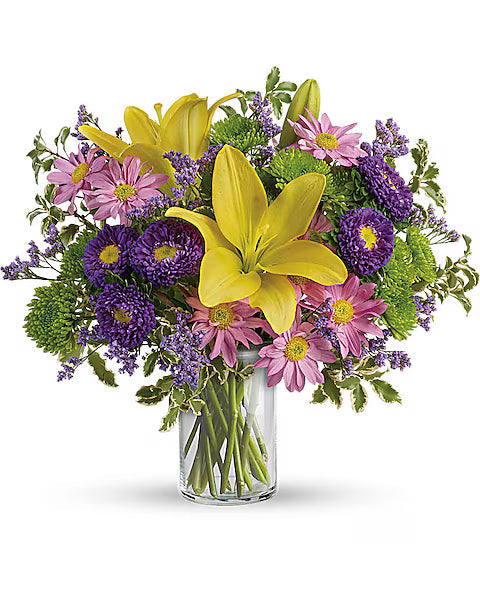 Mixed bouquet of yellow, pink, and purple flowers