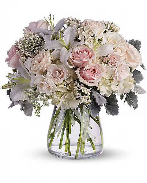 Colorful pink and white flower bouquet in glass vase