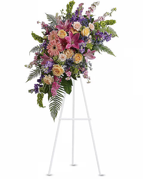 Vibrant flower centerpiece on white stand