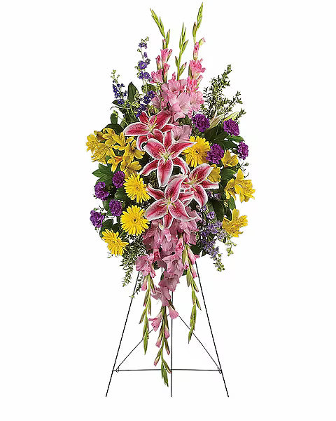 Colorful floral arrangement with pink lilies, yellow daisies, and purple flowers