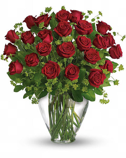 Bouquet of red roses in a clear vase on a white background